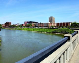 View of the City of Binghamton from a bridge looking across a river, located in the Southern Tier of New York State. 