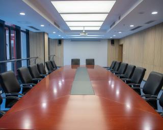 An empty boardroom with table and chairs. 