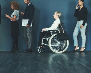 Shot of a woman in a wheelchair waiting in line to be interviewed