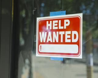 Help wanted sign in window