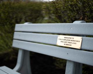 Bench with plaque for Workers' Memorial.
